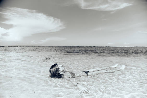 istock Slim woman enjoying on a sandy tropical beach. 1089665118