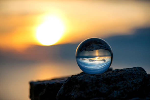 istock Upside down sunset landscape at Cape Kaliakra, Bulgaria, Eastern Europe - reflection in a lensball - selective focus, space for text 1089673724