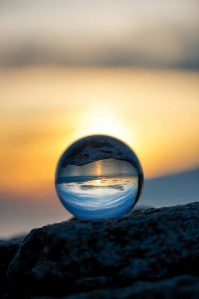 istock Upside down sunset landscape at Cape Kaliakra, Bulgaria, Eastern Europe - reflection in a lensball - selective focus, space for text 1089673802