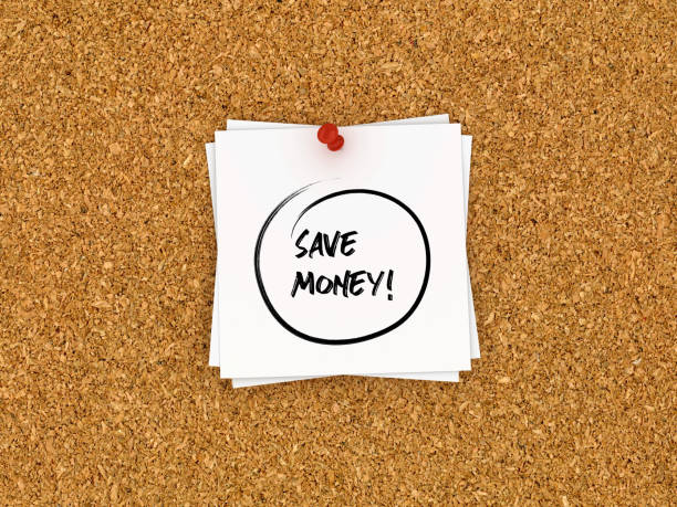 istock Sticky Note on Corkboard with SAVE MONEY! Words - 3D Rendering 1089673956