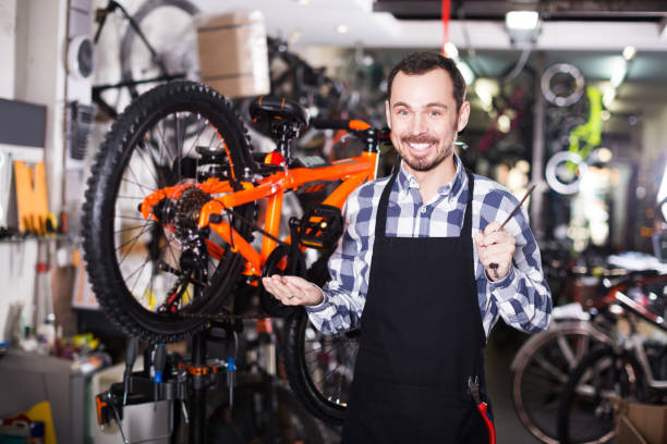 istock Mechanic in bicycles store workshop 1089674126