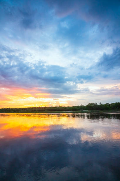 istock Scenic sunset on the river. Colorful reflection in the water 1089676480