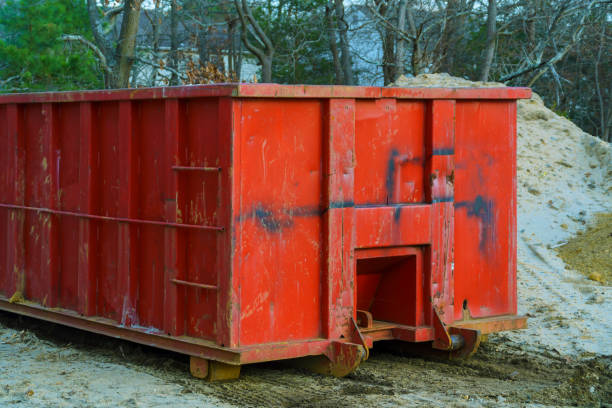 istock Red metal waste container with building debris 1089685052