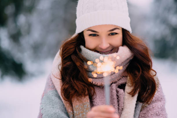 istock young happy woman holding burning sparklers 1089688596