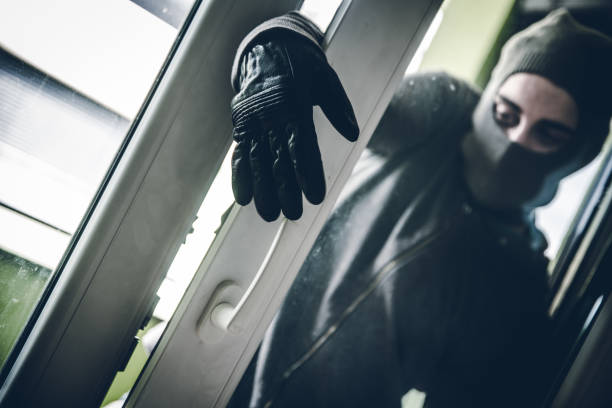 istock Burglar Breaking Into House 1089692282