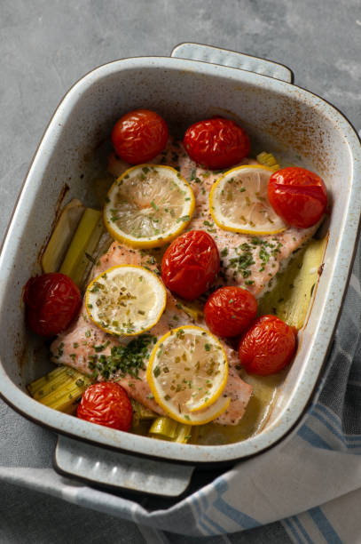 istock Oven baked salmon with leek and tomatoes. 1089696196