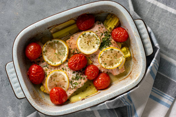 istock Oven baked salmon with leek and tomatoes. 1089696204