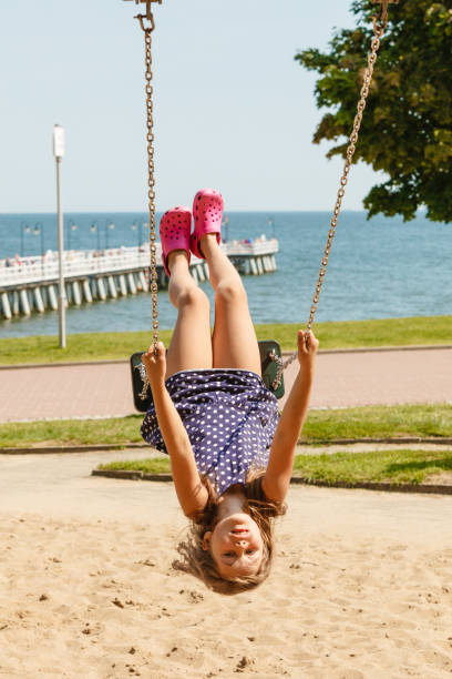 istock Playful crazy girl on swing. 1089696692