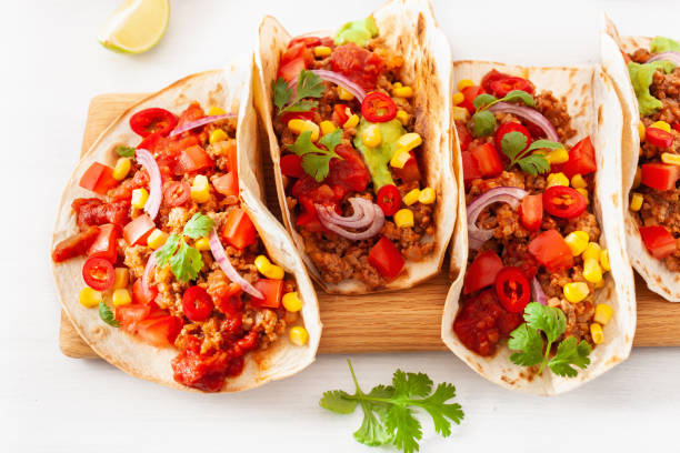 istock mexican beef and pork tacos with salsa, guacamole and vegetables 1089701354
