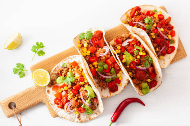 istock mexican beef and pork tacos with salsa, guacamole and vegetables 1089701680