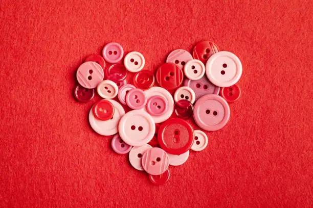 Photo of Plastic buttons heart on felt