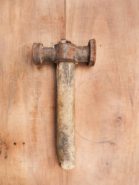 istock Old hammer on a wooden table 1089702792