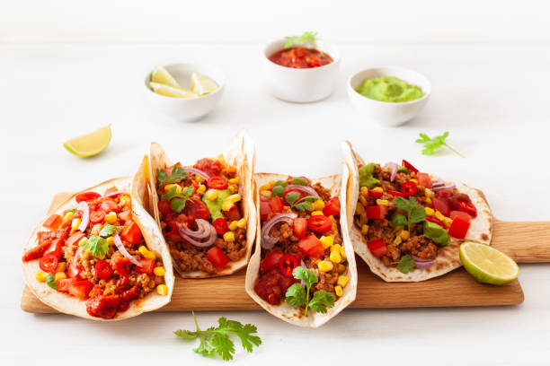 istock mexican beef and pork tacos with salsa, guacamole and vegetables 1089702914