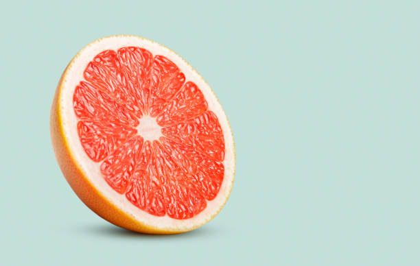 istock Perfect red grapefruit slice on pastel green 1089703006