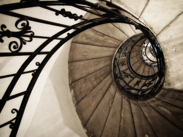 istock Spiral staircase in an old house with iron railings 1089703270