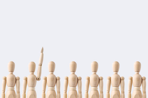 istock wooden mannequin rise hand isolated on white background 1089709510