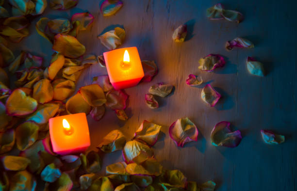istock petals and candles on wooden background selective 1089709592