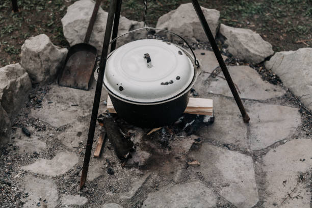 istock bowler hat on tripod weighs on chain over fire 1089710304