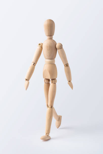istock walk wooden mannequin isolated on white background 1089714614