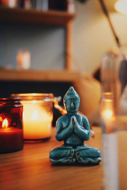 istock Turquoise porcelain buddha indoors in candle light and beautiful settings 1089714886