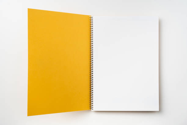 istock Top view of yellow spiral notebook with open page 1089717760