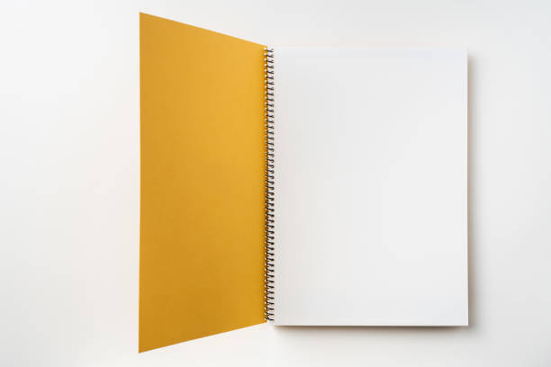 istock Top view of yellow spiral notebook with open page 1089717790