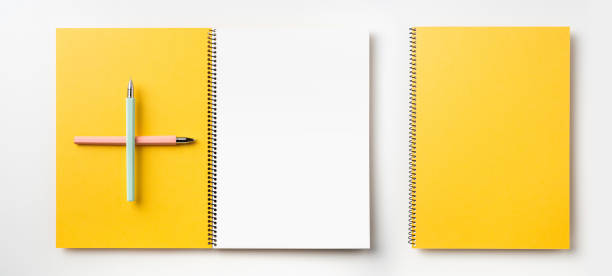istock Top view of yellow spiral notebook, page, pencil 1089717912