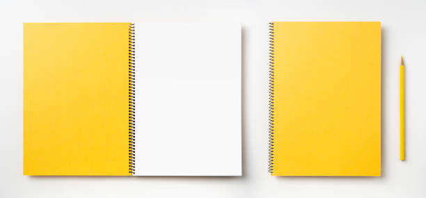 istock Top view of yellow spiral notebook, page, pencil 1089717960