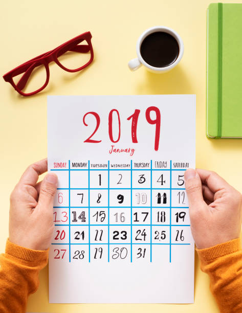 istock man with a calendar of 2019 1089720628