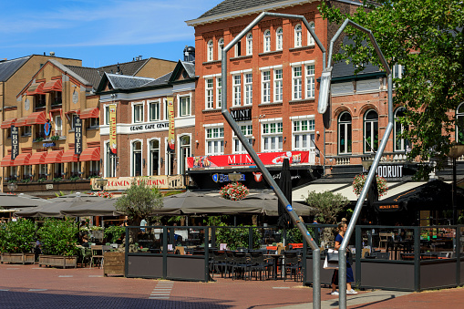 Eindhoven, Netherlands - July 16, 2018; terraces on Eindhoven's Markt, the main square in the heart of the city with restaurants, bars and stores