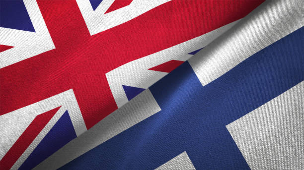 istock Finland and United Kingdom two flags together realations textile cloth fabric texture 1089726412