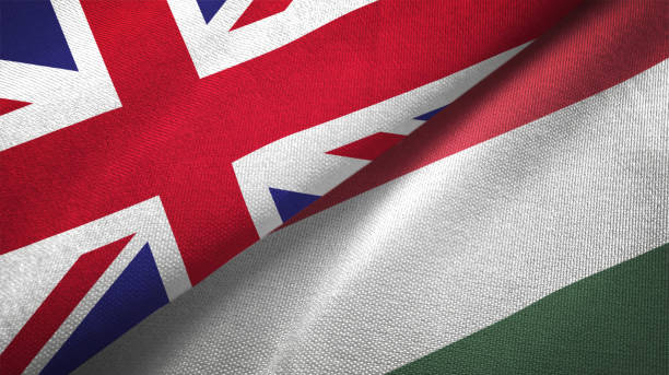 istock Hungary and United Kingdom two flags together realations textile cloth fabric texture 1089726454