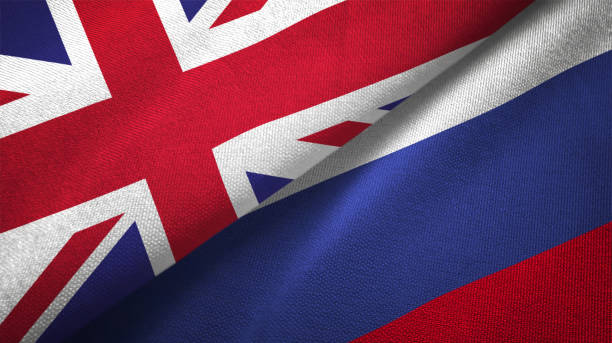 istock Russia and United Kingdom two flags together realations textile cloth fabric texture 1089728032
