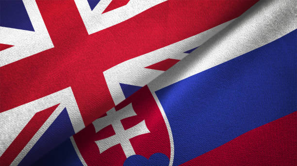 istock Slovakia and United Kingdom two flags together realations textile cloth fabric texture 1089728162
