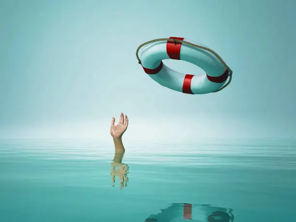 Photo of Thrown life buoy saving drowning person. This is a 3d render illustration