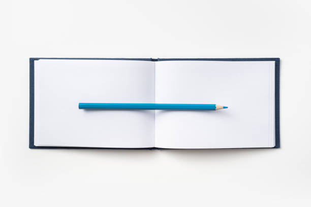 istock Top view of blue hardcover notebook and pencil 1089728976