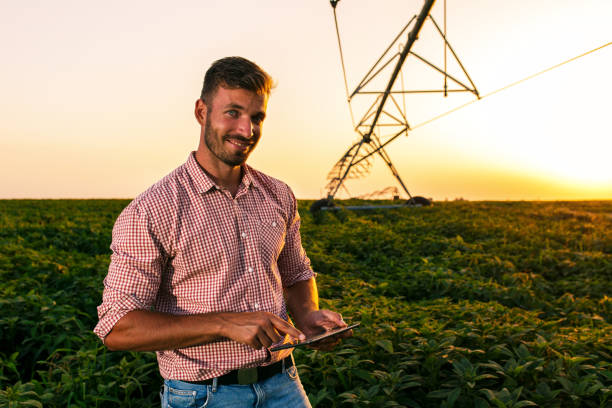 istock Young farmer standing in filed. 1089729062