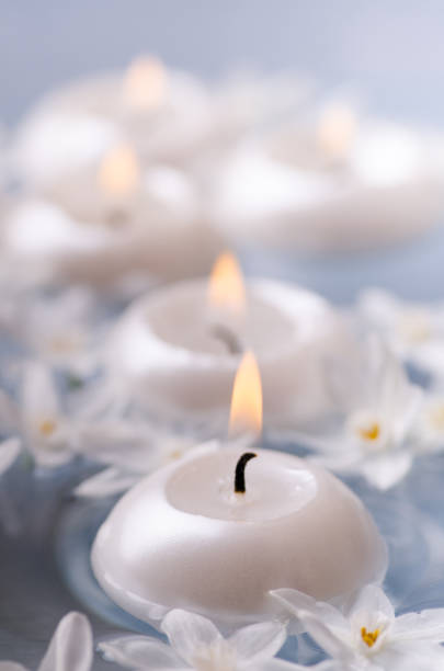 istock aromatherapy with candles and flowers white daffodils 1089733368