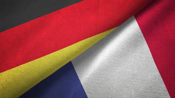 法國和德國兩面旗幟一起實現紡織布織物紋理 - 德國國旗 個照片及圖片檔