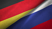 Russia and Germany two flags together realations textile cloth fabric texture