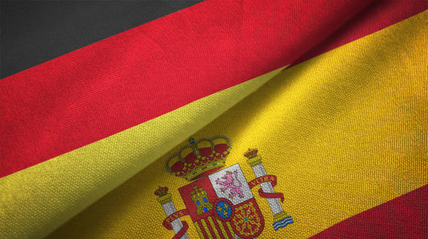 испания и германия два флага вместе realations текстильной ткани ткани текстуры - german flag стоковые фото и изображения