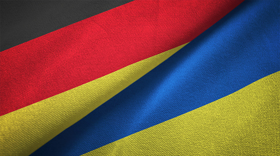 Ucrania y Alemania dos banderas juntos relaciones textil tela textura de la tela photo