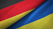 Ukraine and Germany two flags together realations textile cloth fabric texture