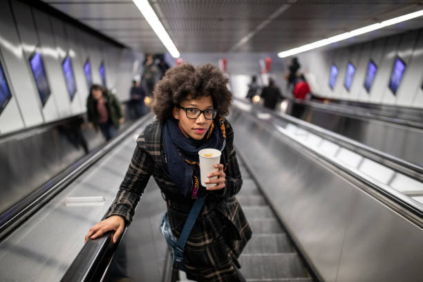 istock Young woman on the escalator 1089742330