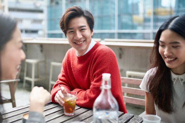 istock Happy man enjoying drink during social gathering 1089751176