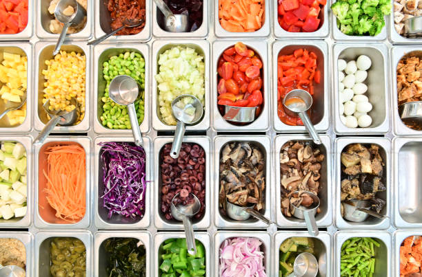 Top view of salad bar with assortment of ingredients stock photo