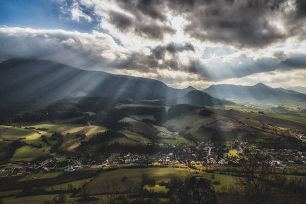 Sun rays over autumn country. Cloudscape at sky. Region Orava, Slovakia