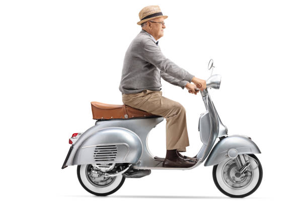 istock Senior gentleman riding a vintage scooter 1089758454