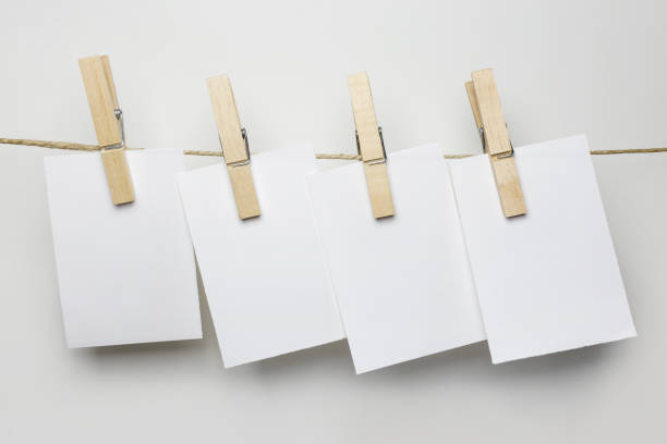 istock Blank paper notes on the rope over white background 1089759082