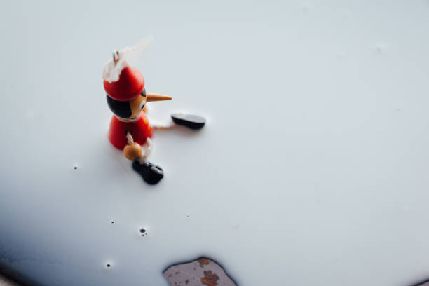 istock Pinocchio and milk drop 1089761260